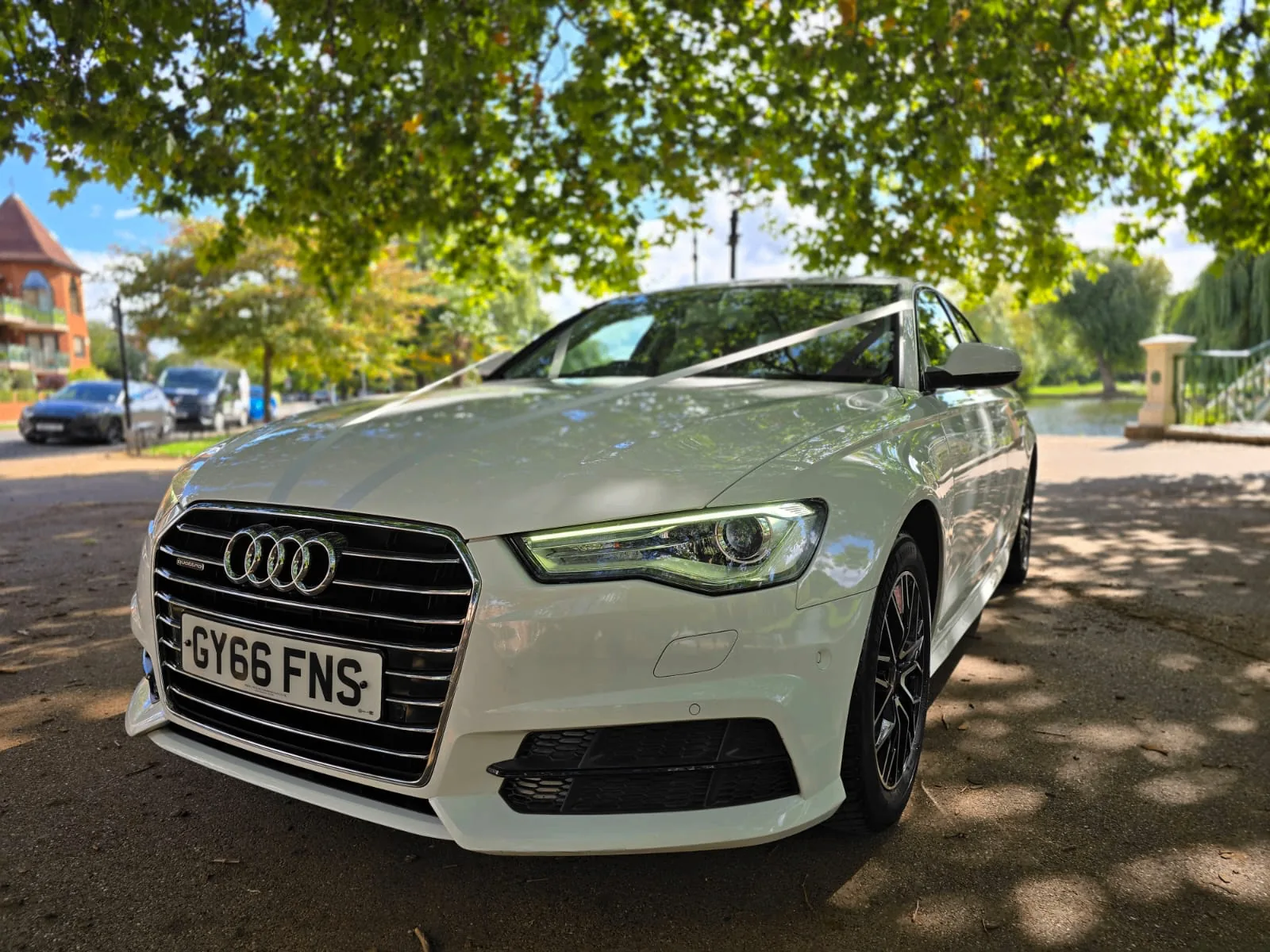 Audi A6 with a chauffeur-driven White 7 car prepared for the occasion